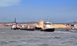 Just before entering the narrow Canal de Caronte, which connects the Mediterranean to the inland sea Étang de Berre, the barge passes the old Fort de Bouc lighthouse. (Click to view larger version...)